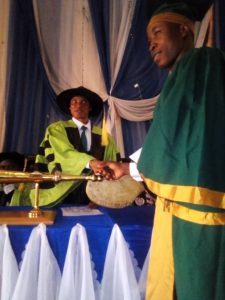 A Student in a handshake with Rector