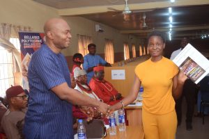 Dr. Charles Olisa (left) with one of the beneficiaries 