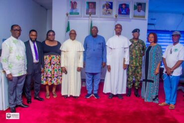 The Vice-Chancellor of Admiralty University of Nigeria (ADUN), Professor Christopher Ogbogbo, in a group photograph with members of the Chaplaincy Council of the Stella Maris Catholic Chaplaincy, ADUN, shortly after a courtesy visit to the Vice-Chancellor at the university's main campus in Ibusa, Delta State.